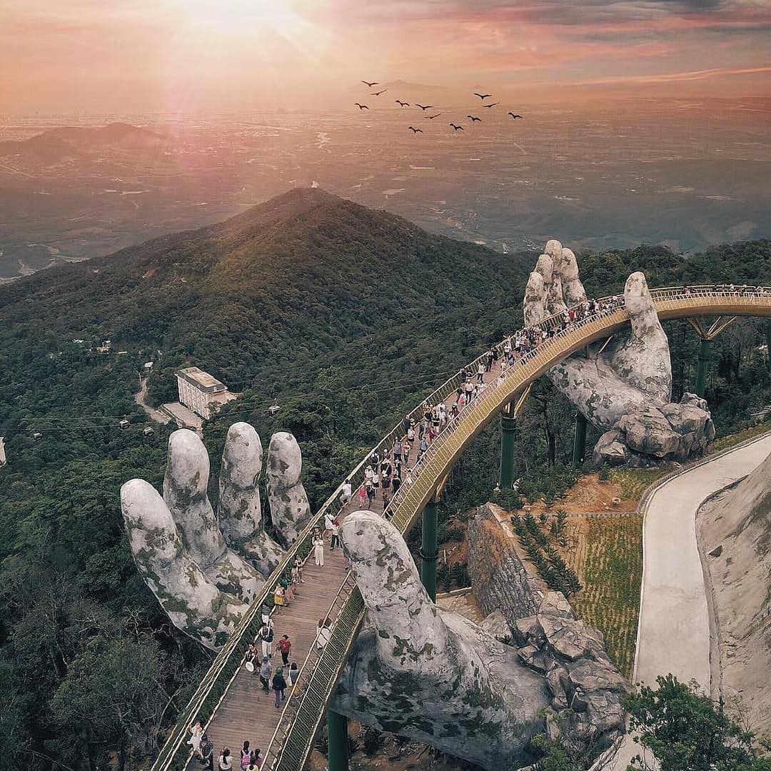 Giant hands lifting up Vietnam's Golden Bridge