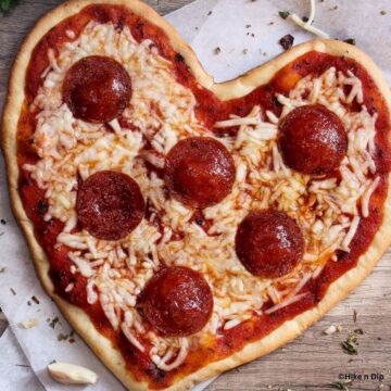heart shaped pizza with pepperoni slices